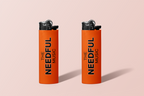 Two orange lighters with 'The Needful Music' branding on a pale pink background