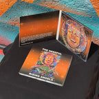 two cd cases for rising angels album, one laying flat on a table, the other open to see the artwork.