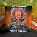 Vinyl album cover for 'Rising Angels' by The Needful against a textured wall background.