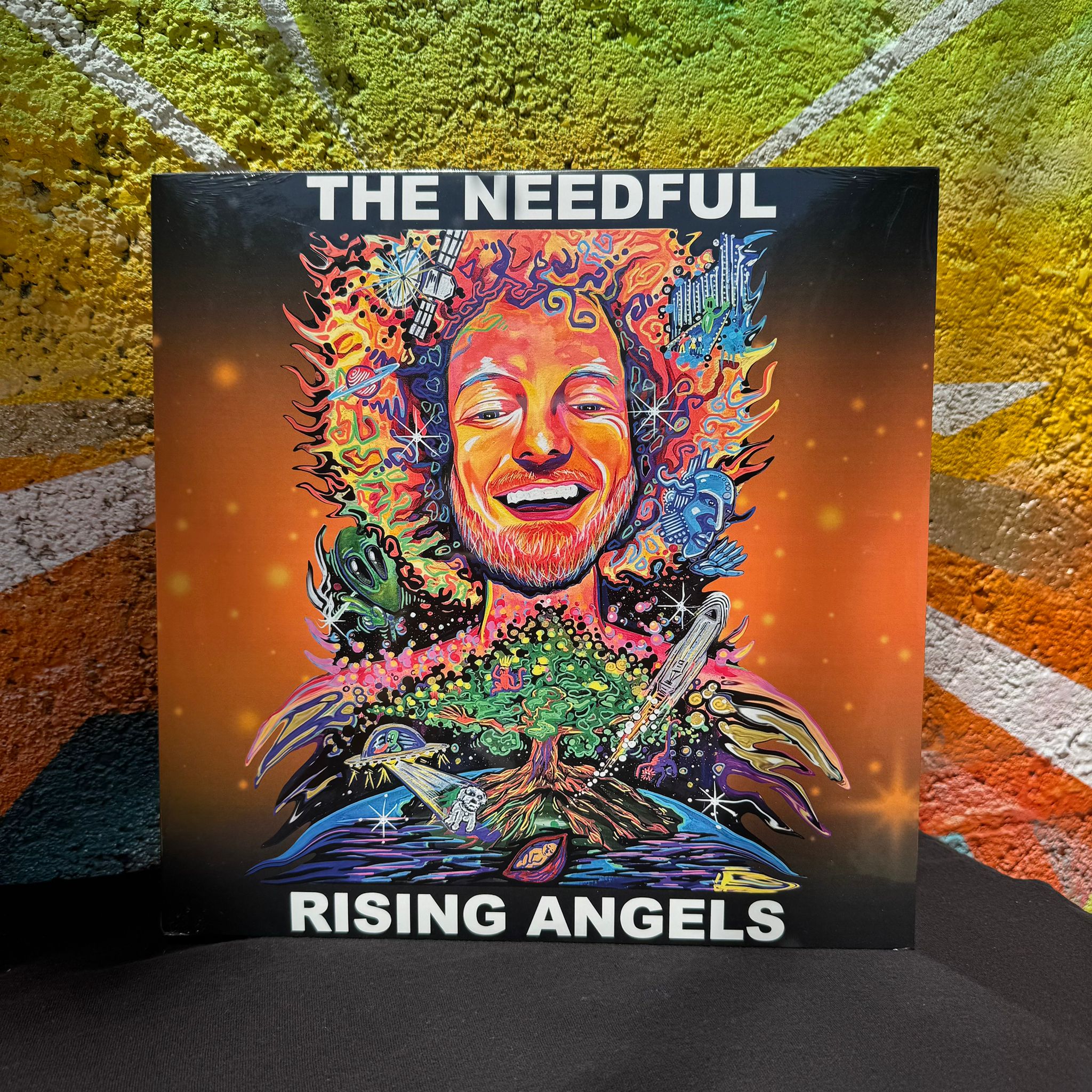 Vinyl album cover for 'Rising Angels' by The Needful against a textured wall background.