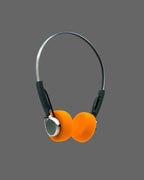 Orange retro headphones with black wires on a white background