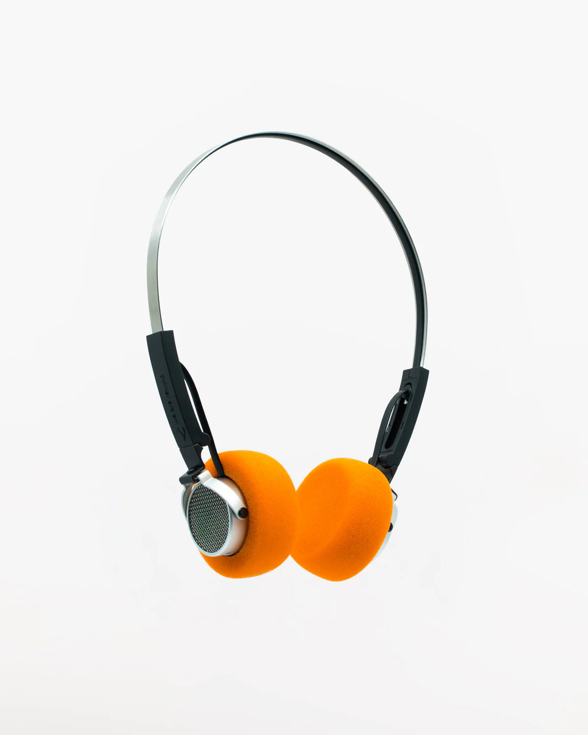 Orange retro headphones with black wires on a white background